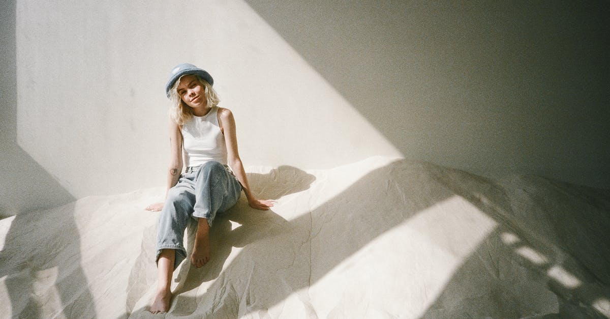 Is there a length cap? - Woman in White Top and Blue Denim Jeans