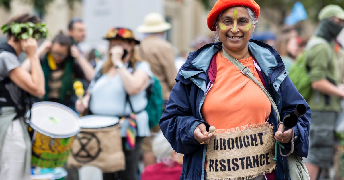 Is there a population cap for cities in SC4? - Smiling old woman with a banner pinned to clothes