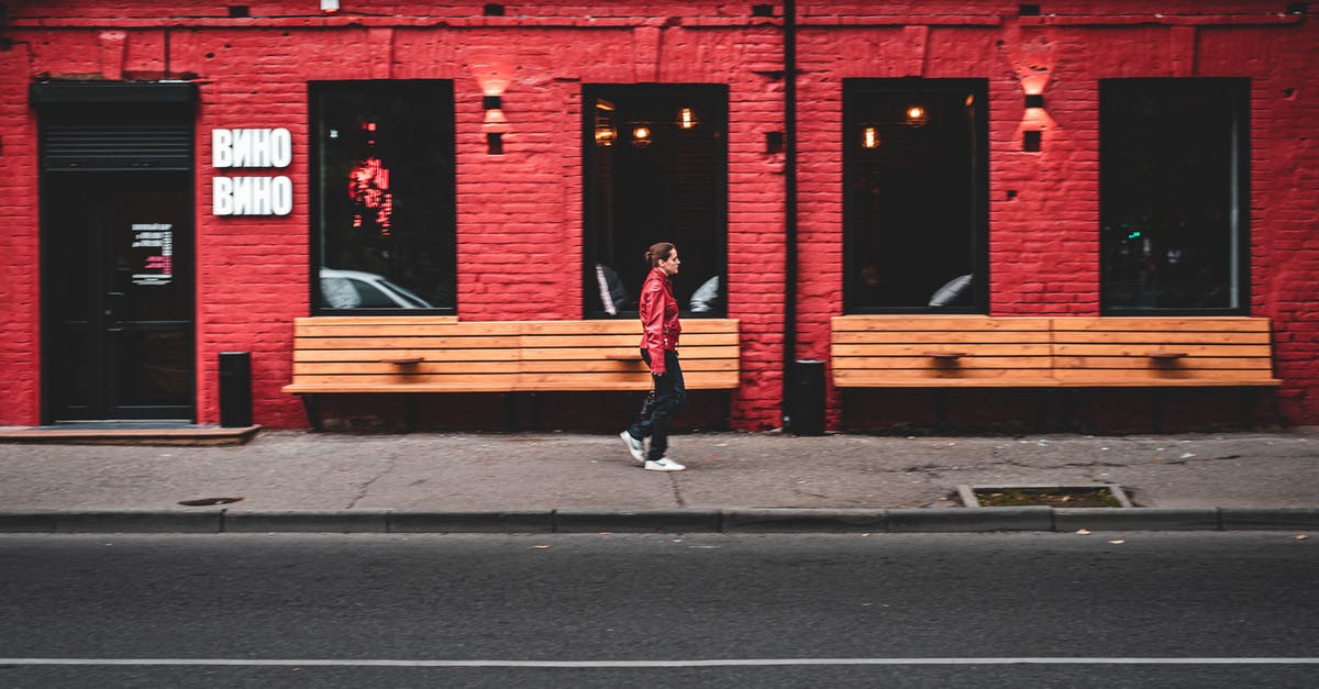 Is there a way I can store variables in my Minecraft world? - Side view of modern female walking on sidewalk near red building on city street Is there a way I can store variables in my Minecraft world? - Side view of modern female walking on sidewalk near red building on city street