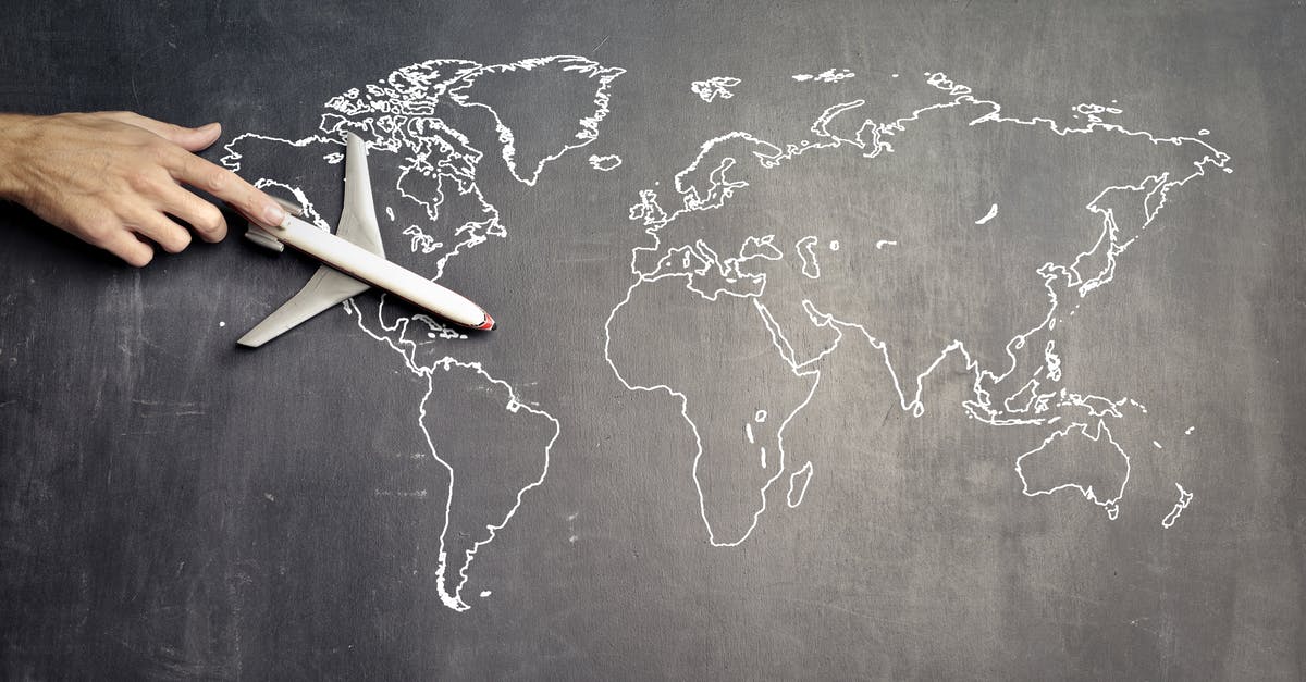 Is there a way to change displayed buttons? - From above of crop anonymous person driving toy airplane on empty world map drawn on blackboard representing travel concept