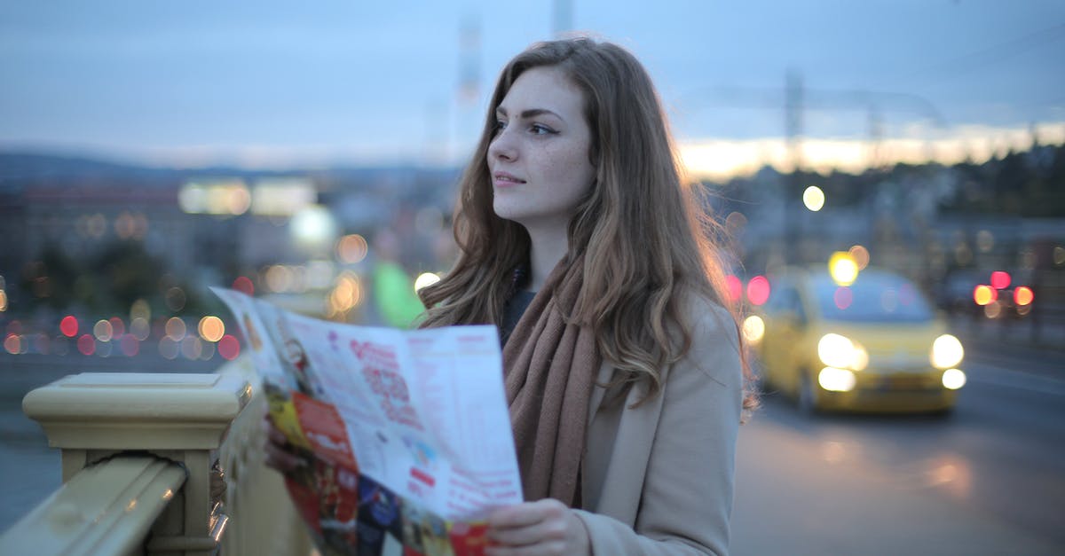 Is there a way to disable global warming and nuclear winter once the game has started? - Female traveler in warm clothes standing on street with map and looking away at dusk Is there a way to disable global warming and nuclear winter once the game has started? - Female traveler in warm clothes standing on street with map and looking away at dusk
