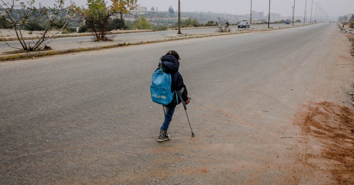 Is there a way to disable upgraded special agents? - Girl with leg amputation on asphalt road in gloomy weather