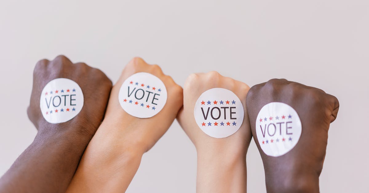 Is there any penalty for being vote kicked? - Close Up Photo of Vote stickers on People's Fist