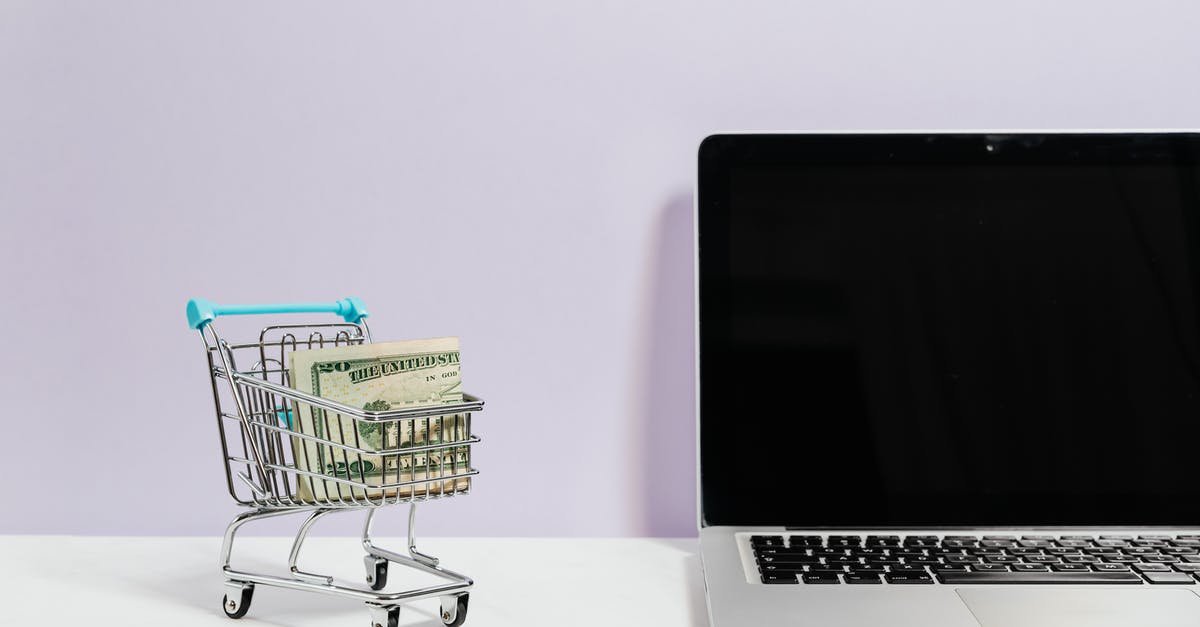 Is there any reason not to sell money pins? - Macbook Pro on White Table Beside a Miniature Shopping Cart With Money