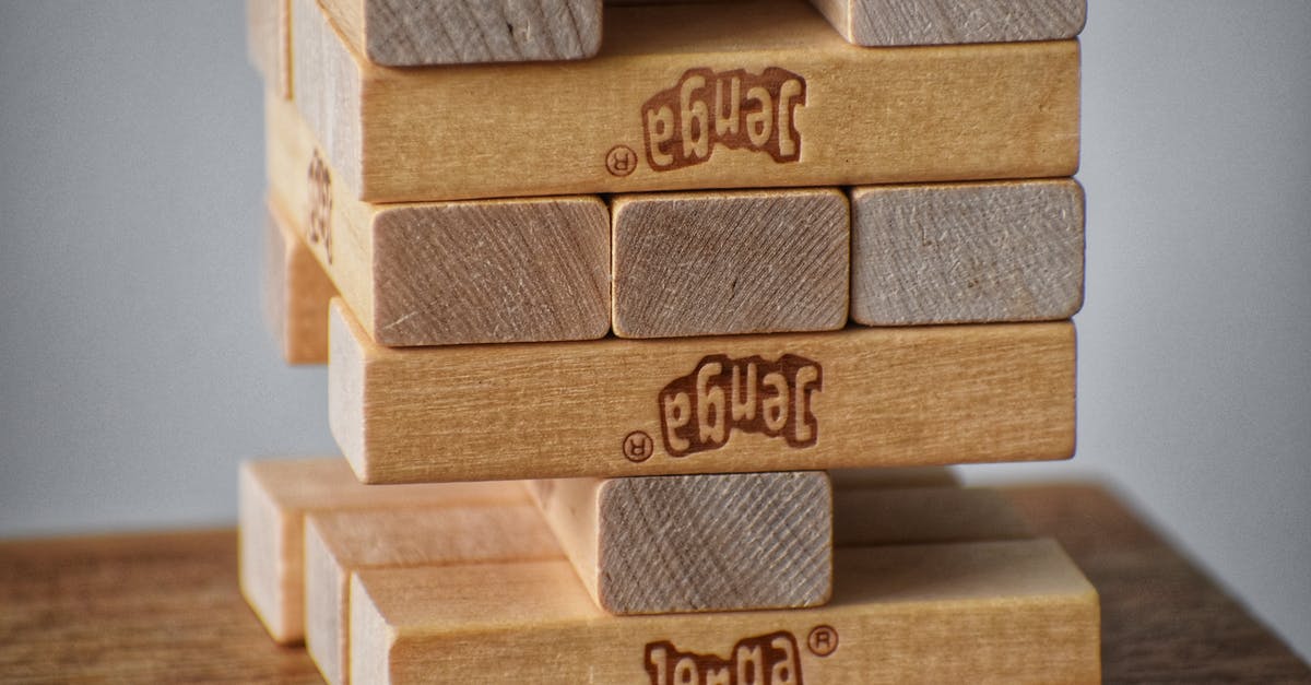 Is there any strategy for acquiring specific items? - Closeup of wooden blocks placed on top of each other for playing board game