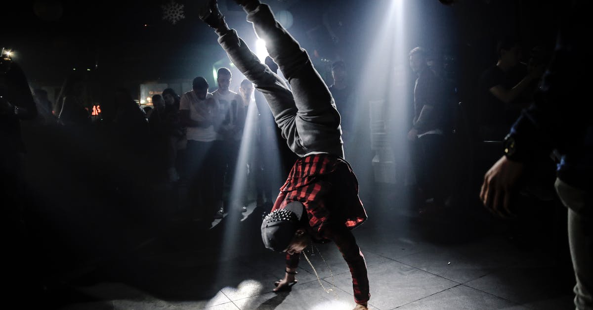 Is there party level balancing? - Man in Plaid Shirt Breakdancing