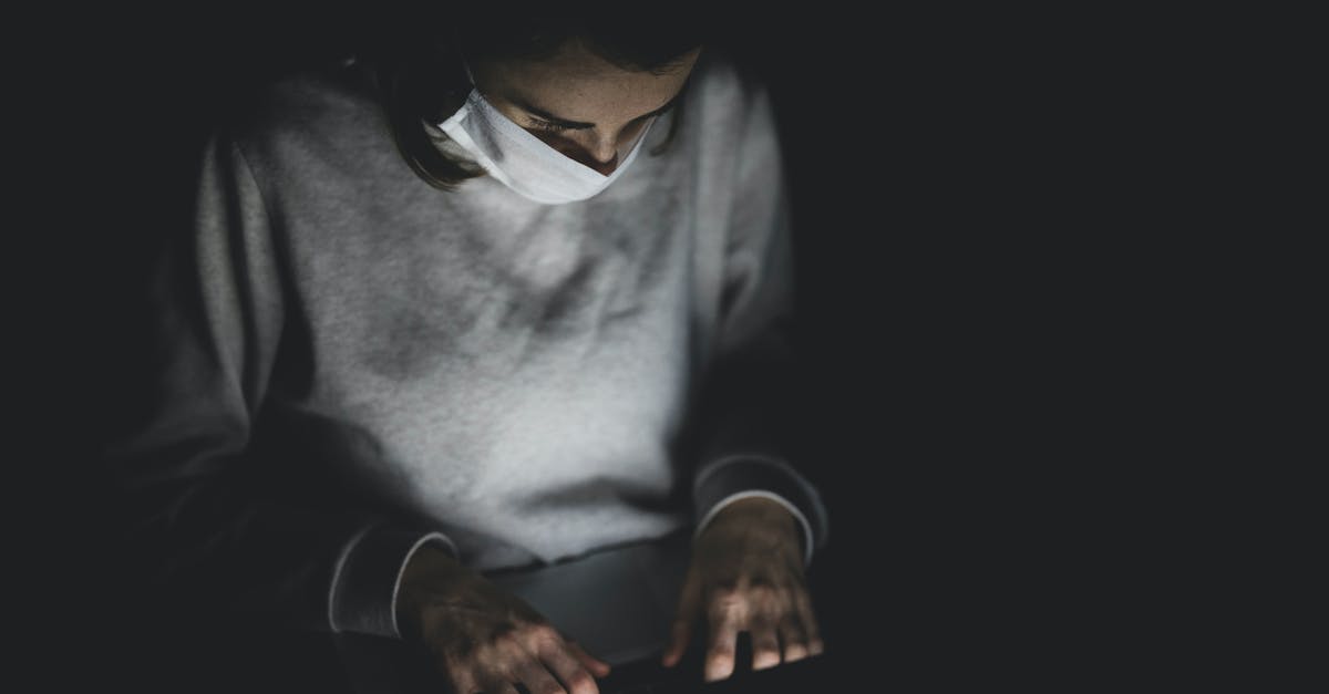 Is there something like a global chat? - Man With Face Mask Using Laptop In The Dark