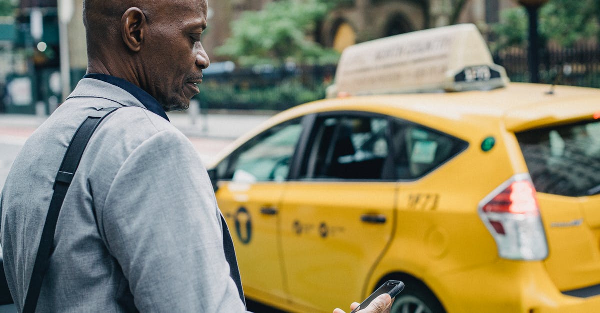 Killer instinct cross plataform online? - Busy black businessman checking notification on smartphone while crossing street