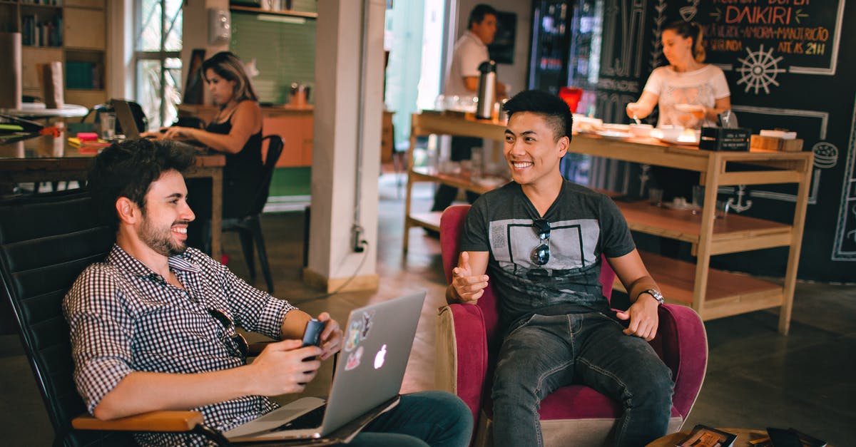 List of chat Commands - Photograph of Men Having Conversation Seating on Chair