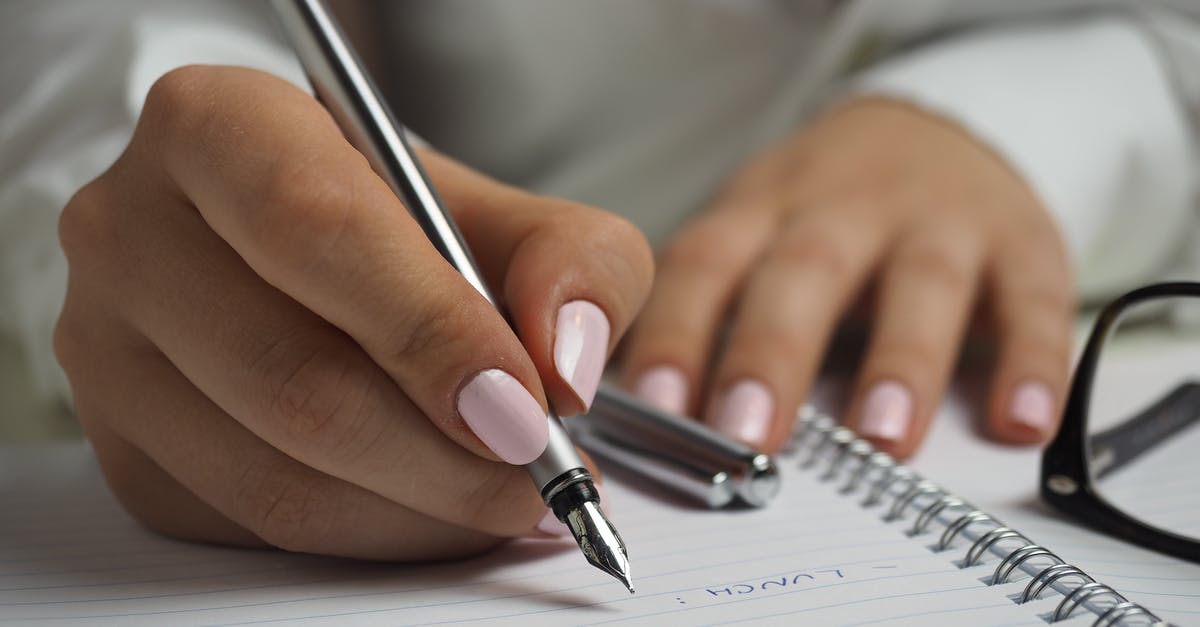 List of chat Commands - Woman in White Long Sleeved Shirt Holding a Pen Writing on a Paper