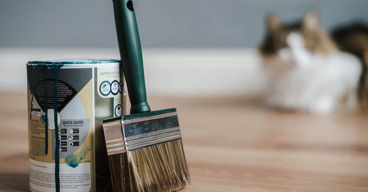 Long-distance fluid handling with pipes - Paint brush near can on floor at home