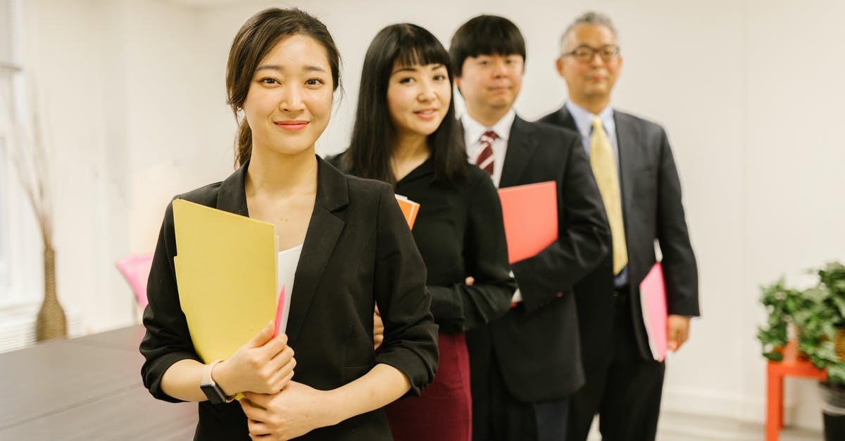 Looking for where addons are downloaded in files - A Woman Posing with her Coworkers at an Office