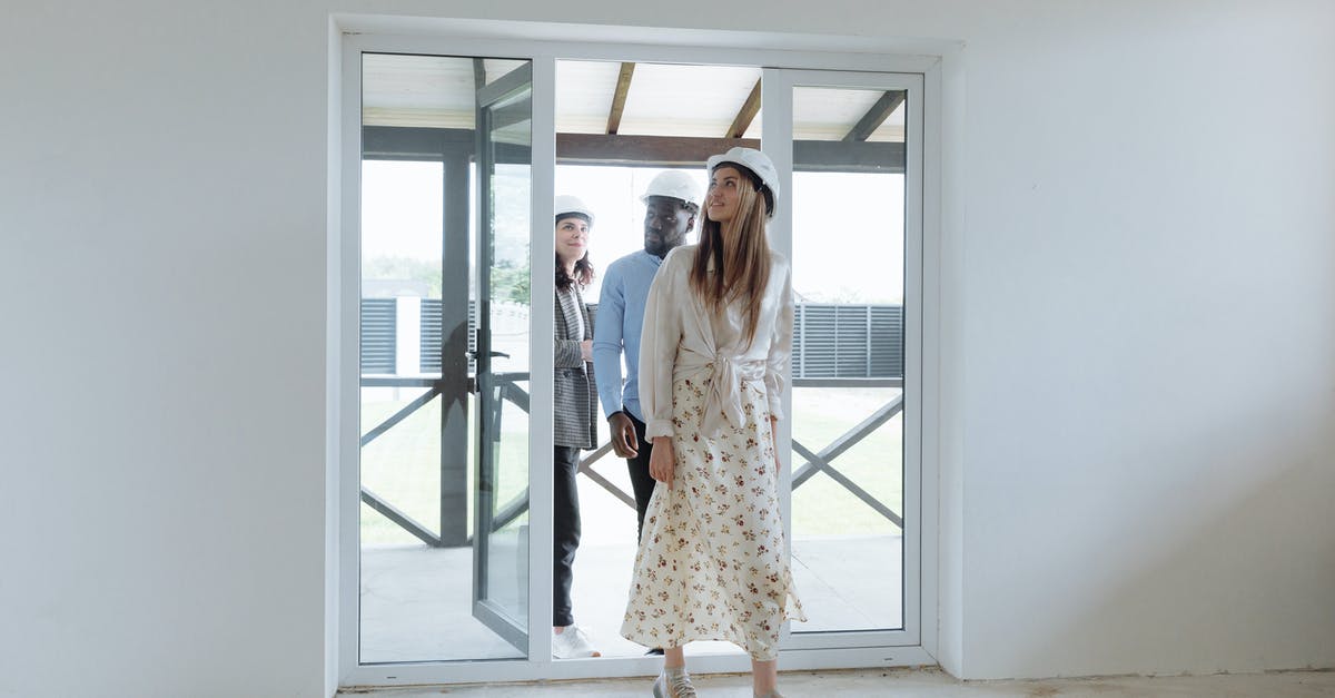 Manning priorities in FTL - Woman in White and Black Floral Dress Standing Near Glass Window