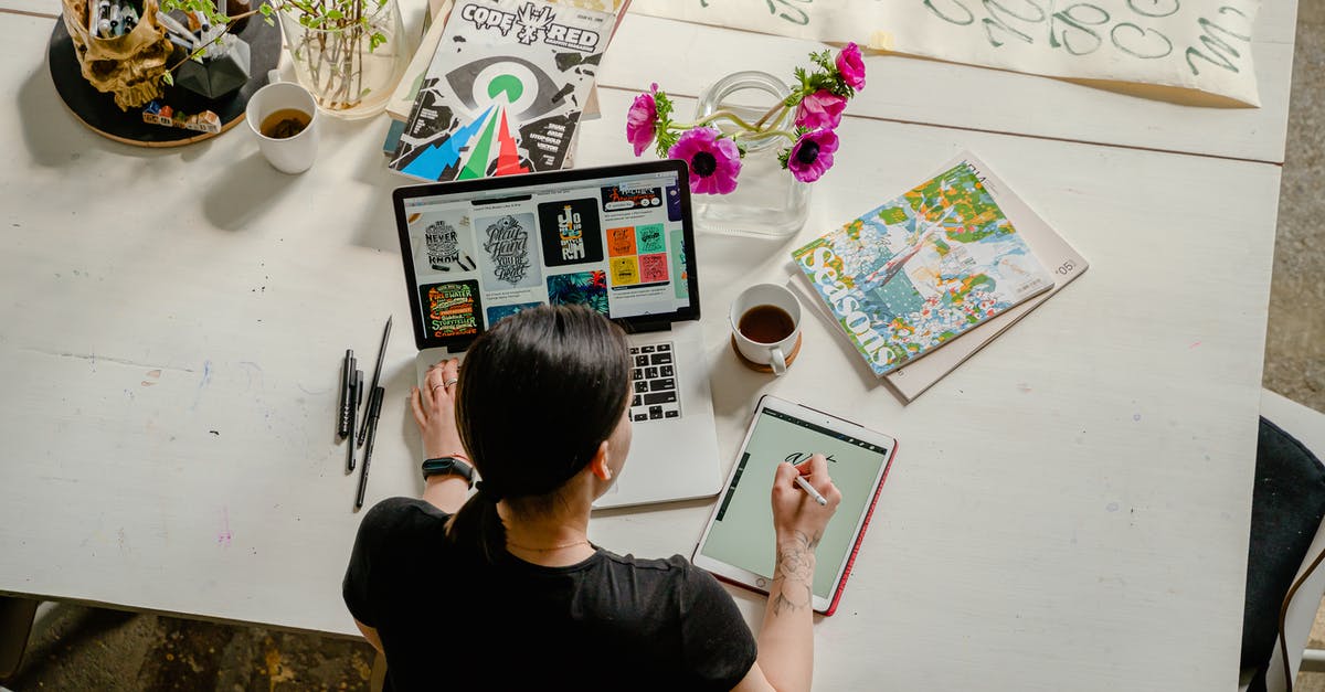 Melding commands with mastered abilities - Photo of Woman Writing on Tablet Computer While Using Laptop