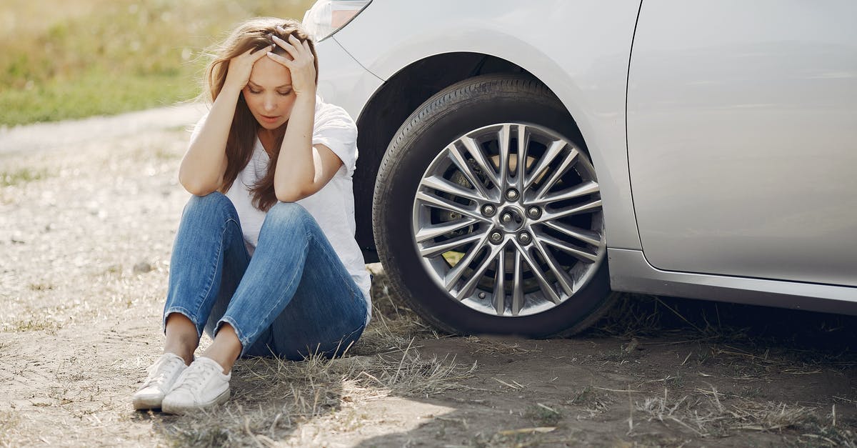 Minecraft 1.9.2 Command /testfor SelectedItem. Need Help - Frustrated female driver in white t shirt and jeans sitting on ground near damaged car with hands on head during car travel in sunny summer day