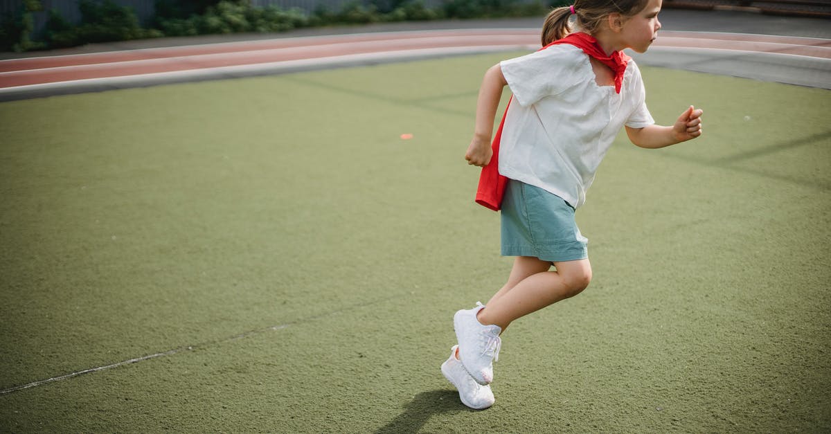 Minecraft Migration Cape Chances of Getting it - Girl in White T-shirt and Red Shorts Running on Green Field