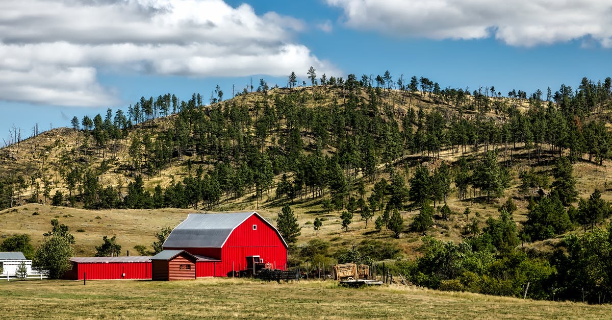 Miners ignore storage barn near the mine - Red Wooden Shed on Farm Land