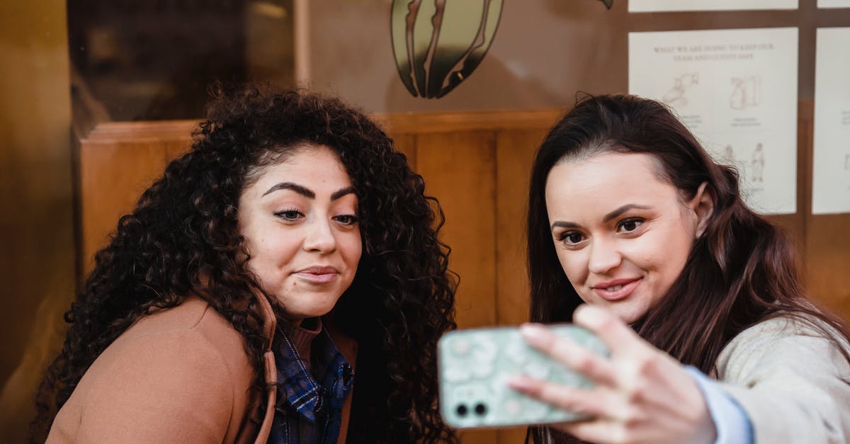 Mount and Blade Warband - How to capture a friendly town? - Smiling multiracial women taking selfie near building