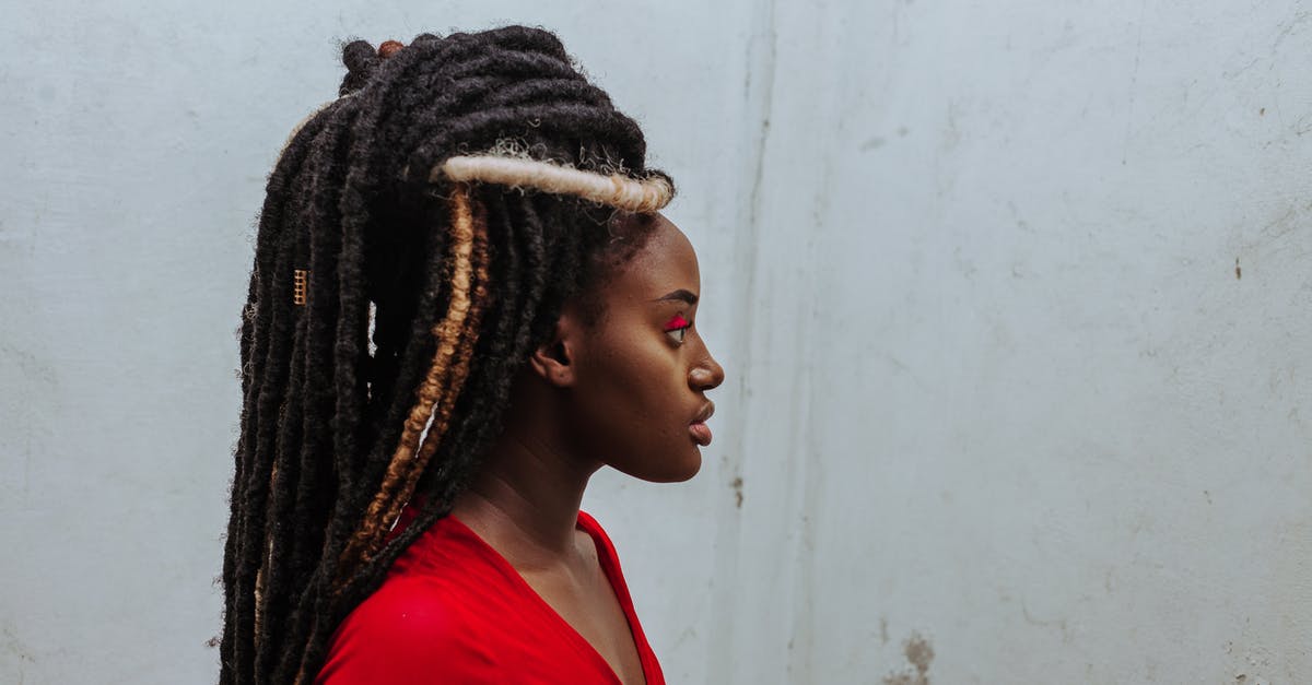 My Minecraft Native Launcher Won't Download - Thoughtful young black woman with dreadlocks looking away against weathered wall