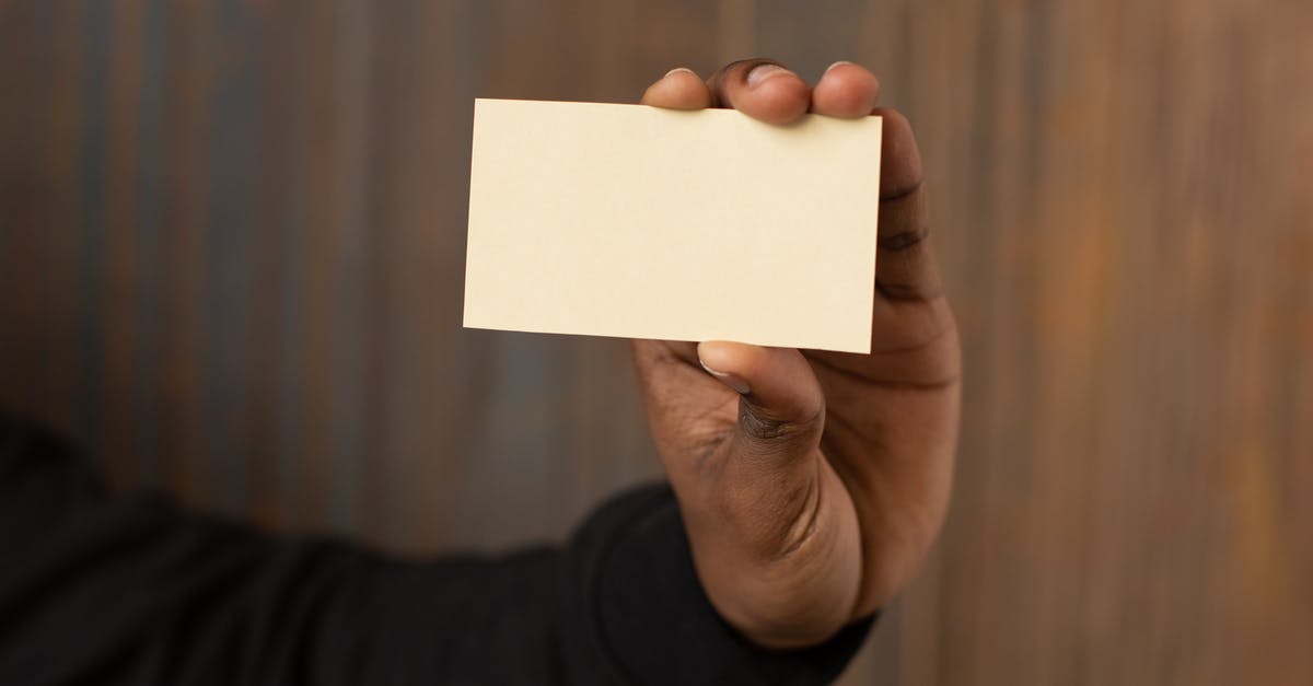 Nothing shows on part of scanner - Unrecognizable black man showing empty business card