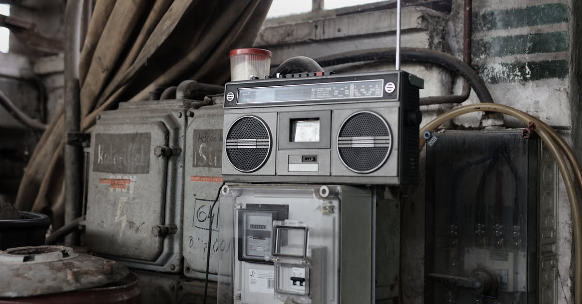 Nu Wa Ult Max Damage - Old fashioned cassette player placed in shabby garage near old industrial equipment