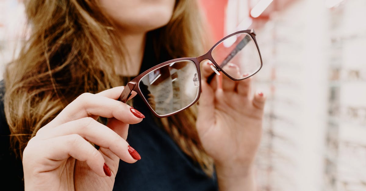 Nvidia 3D Vision option is missing (driver 430+) - Crop female client with stylish glasses in hands picking glasses rim in optical salon