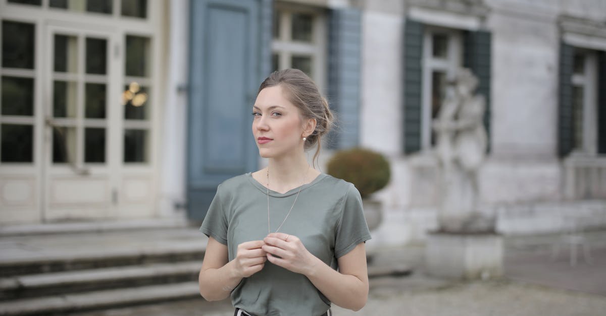 Old iPod that won't upgrade to iOS 7 [duplicate] - Beautiful young woman standing near old building and looking at camera