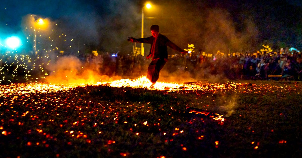 Older artifacts never showing in Temple Run 2 - Full body of unrecognizable male running on hot burning coals during show in evening time