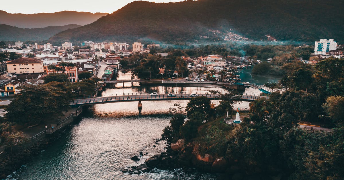 Panama canal not in list of wonders? - Scenic view of coastal town on hilly terrain