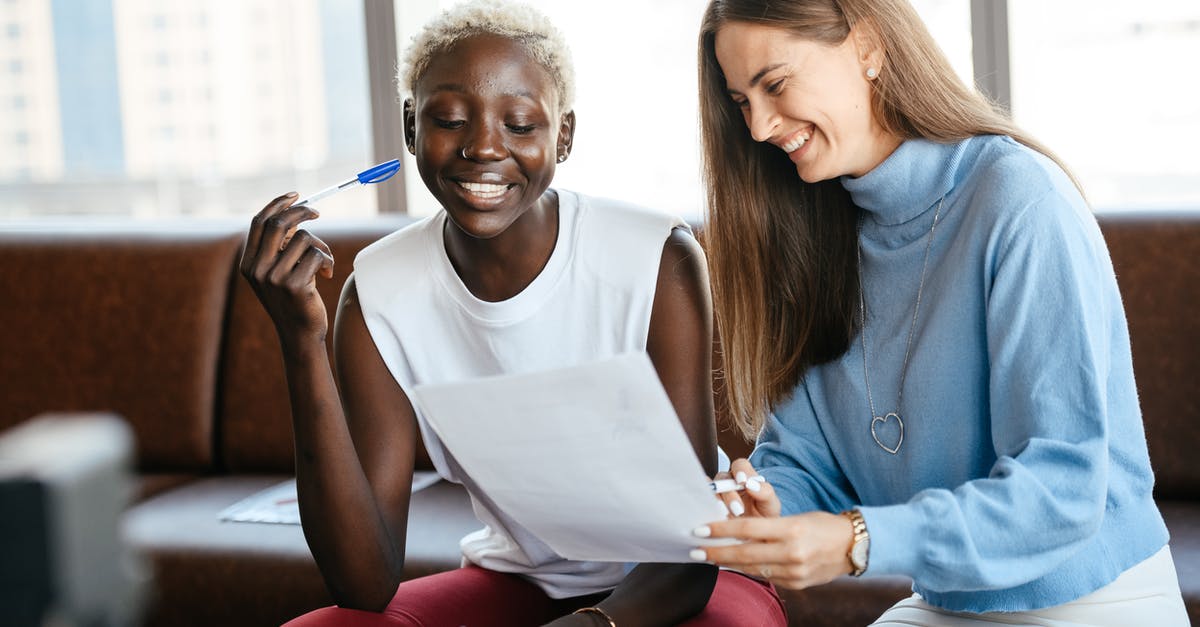 Planetary Scan Job does not show the target - Positive diverse women checking information in document of agreement and smiling together in office