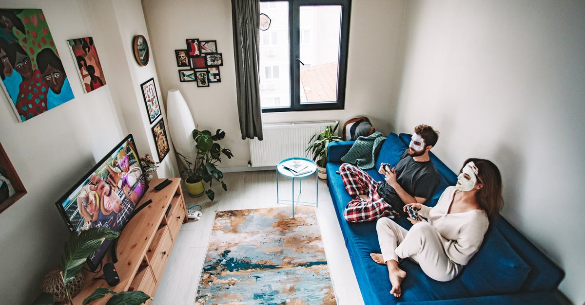 Playing Xbox on a Non-HD TV - Couple Holding Remote Controllers Playing a Video Game