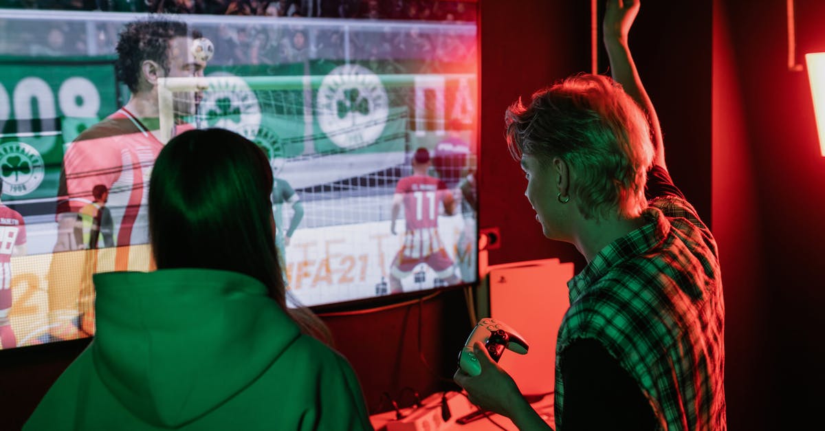 Playing Xbox on a Non-HD TV - A Man and Woman Playing Video Games