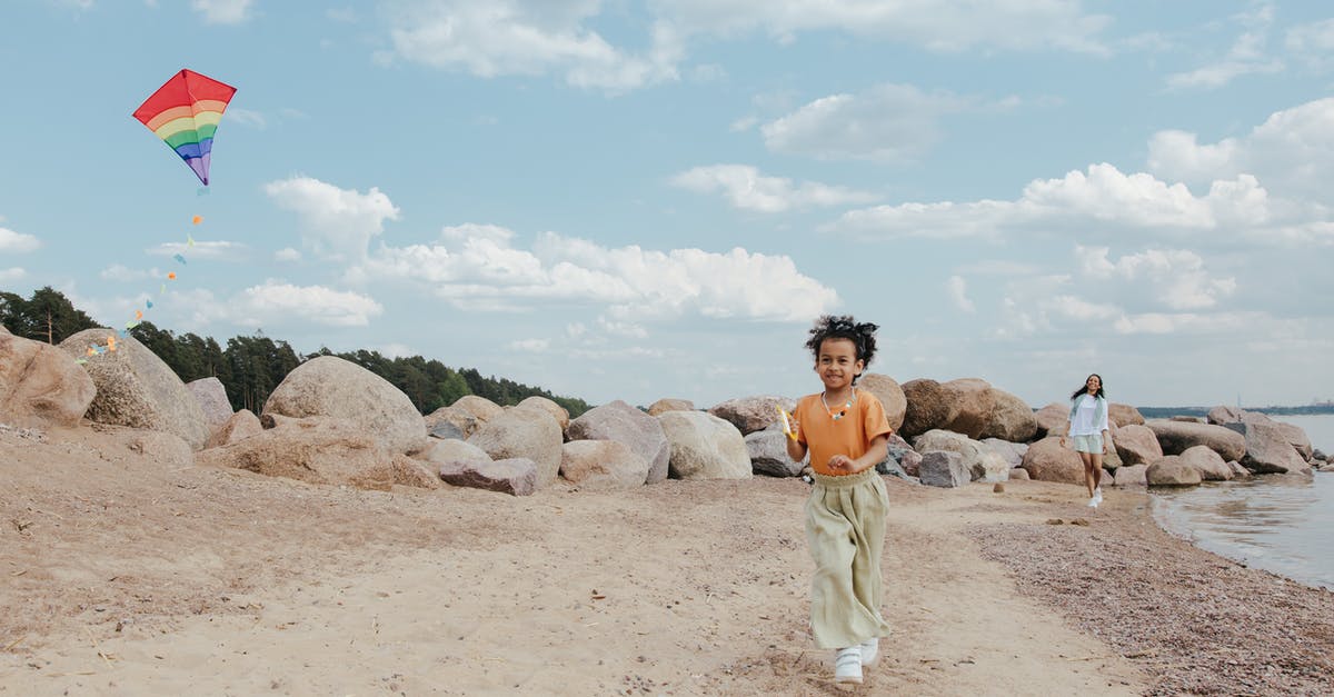 Poison spell and troops running - Woman in White Pants Standing on Brown Sand