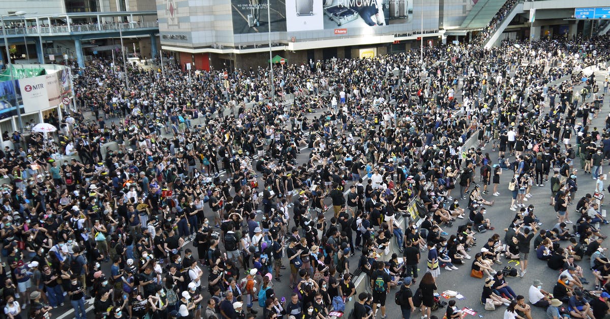 Problem defending Tihr - High angle of crowded street of city downtown gathered together to defend and resist Government