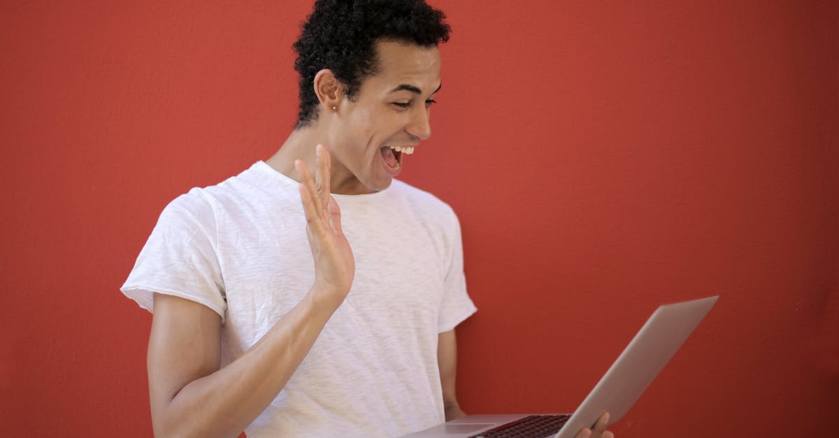 Progression in Wow that avoids spiders [duplicate] - Cheerful man using laptop for video call