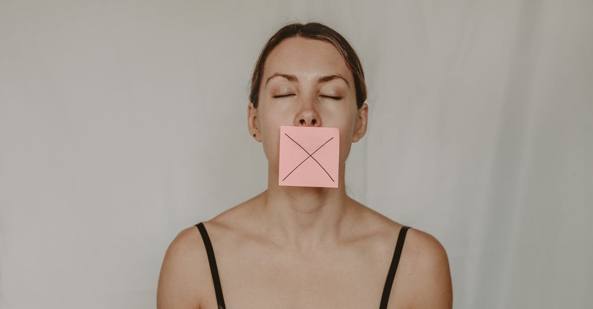 ps2 through HDMI - no signal - Young slender woman with closed eyes and mouth covered with sticky note showing cross on white background