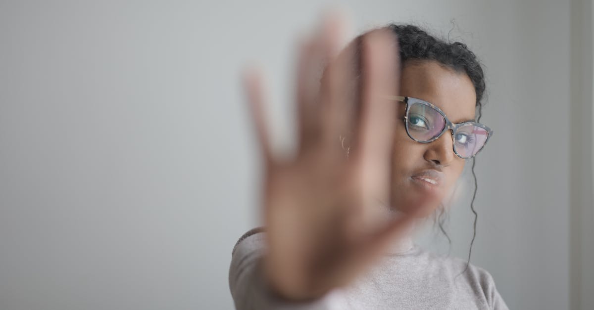 ps2 through HDMI - no signal - Ethnic woman doing stop gesture with palm at camera