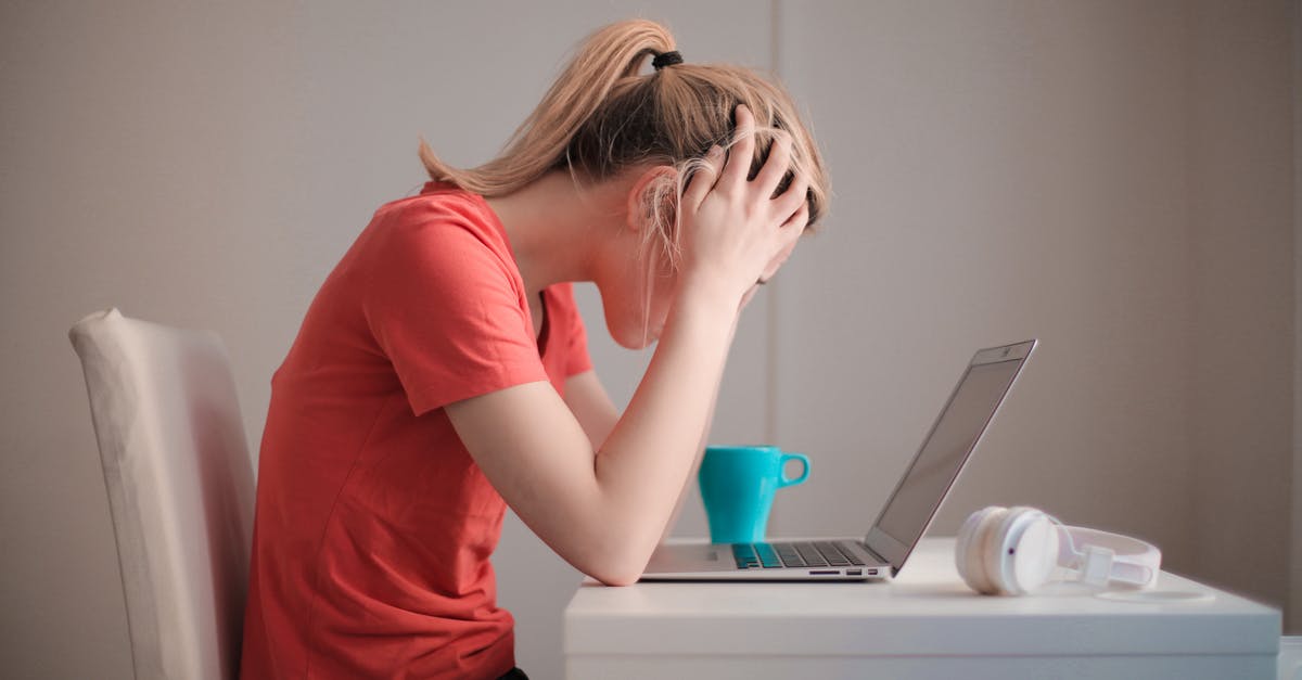 PS3 stuck on 576p - Woman in Red T-shirt Looking at Her Laptop