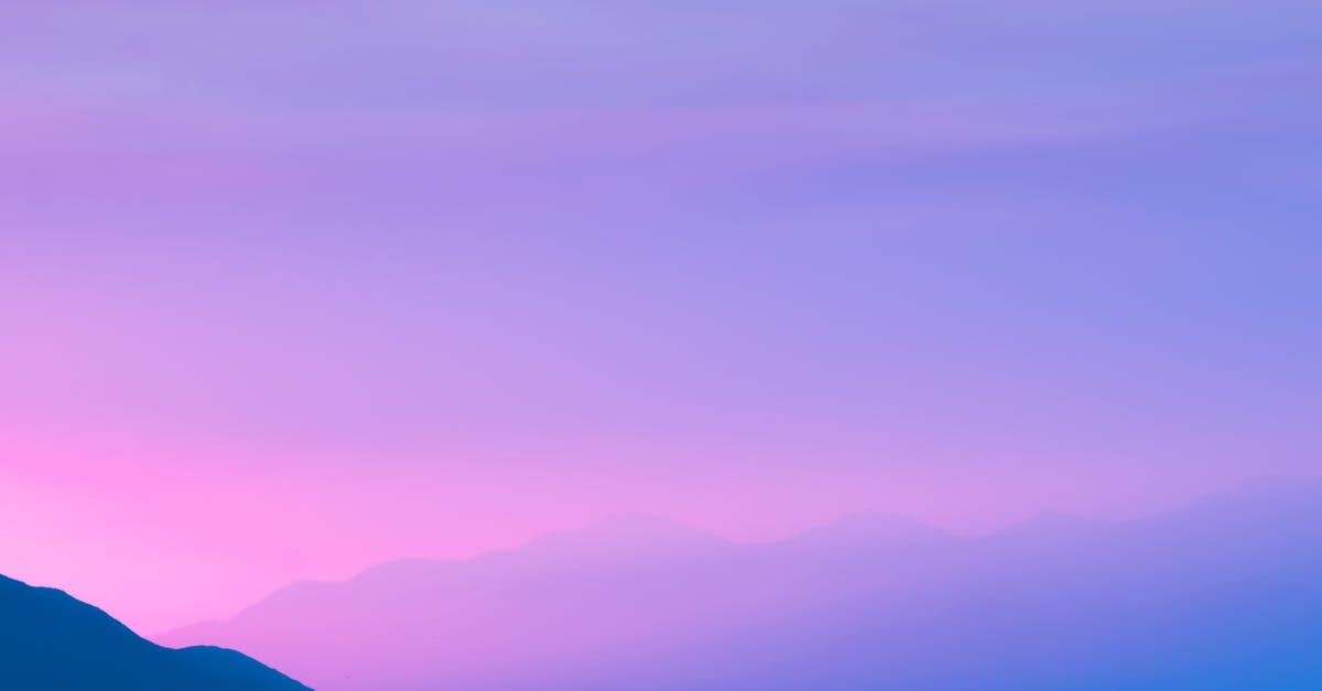 Purple sky in Spore - Silhouette Photo of a Mountain during Sunset