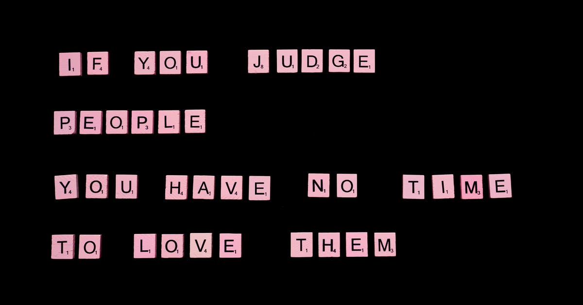 "There is a letter for me" - but where? - If You Judge People You Have No Time To Love Them text spelled out with pink letter tiles of famous word game against black background