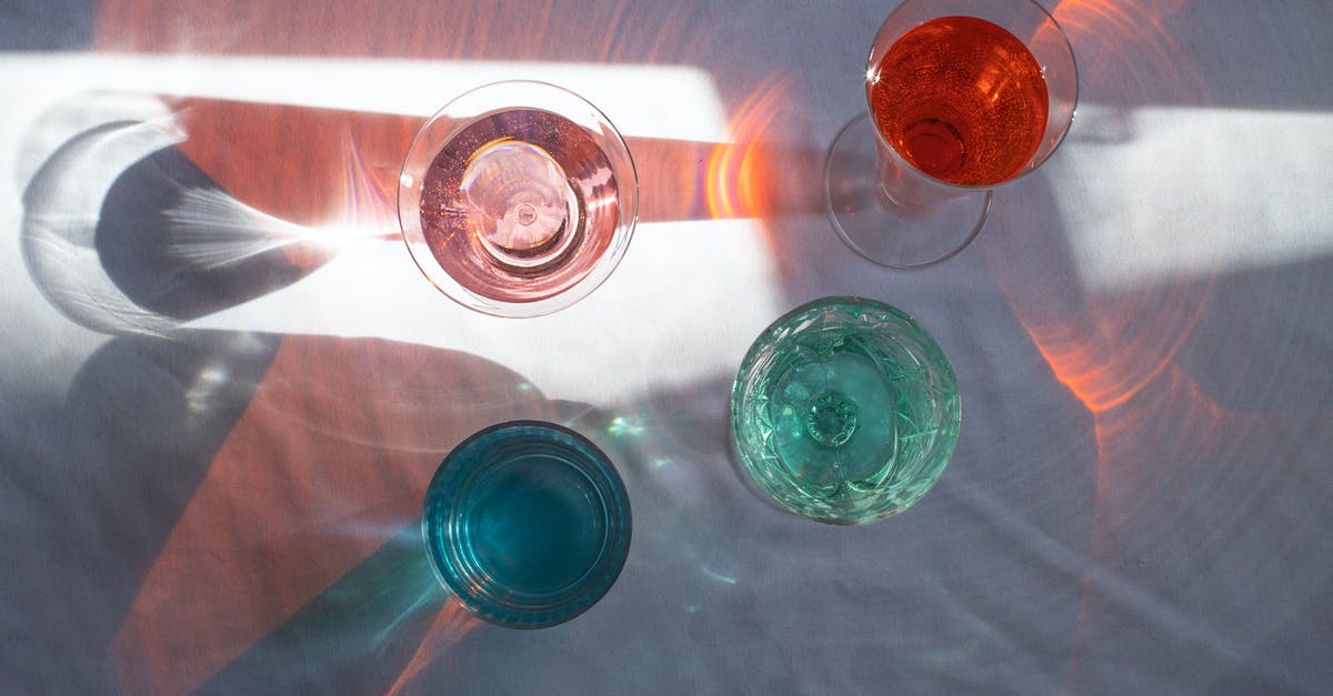 Regenerate Full Health instead of Individual Bars in Mass Effect 3 - Top view of transparent glasses filled with different beverages and placed at sun beam