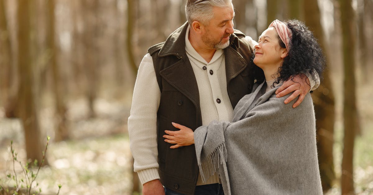 Removing freeze time forever - Photo of Couple Smiling While Looking at Each Other