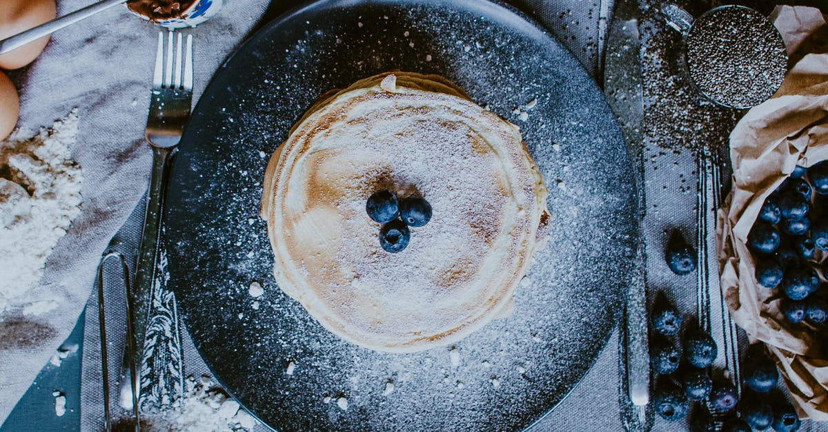 Resident Evil 5 Infinite Golden Egg - From above of plate with yummy homemade golden crepes with fresh blueberries for breakfast