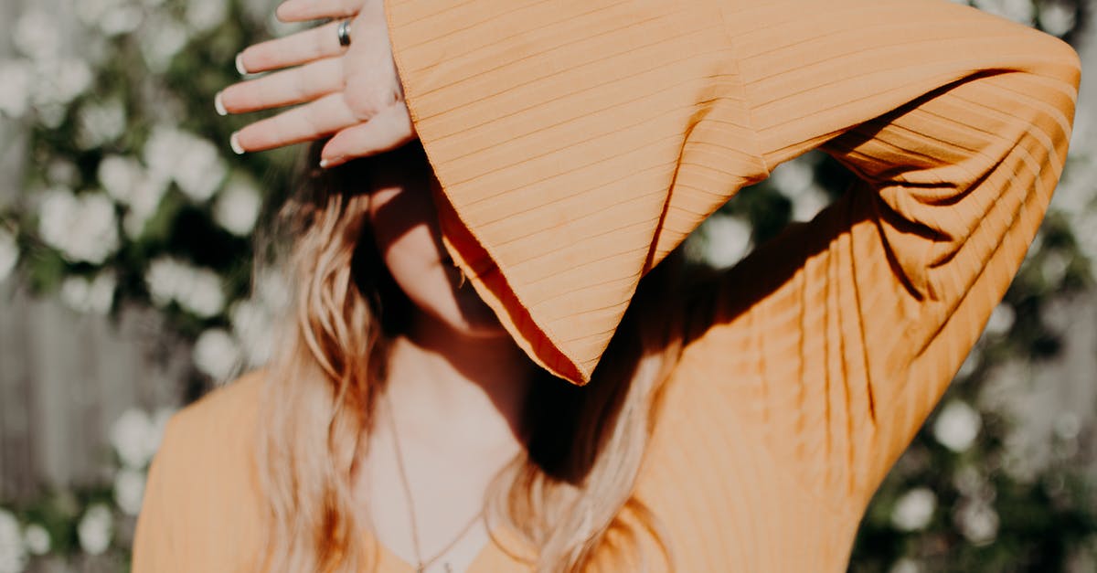 Ring of hircine and saviors hide - Anonymous woman covering face with stylish wear in sunlight