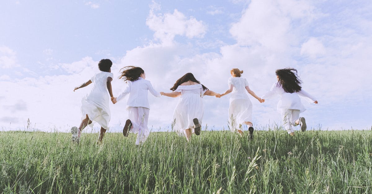 Running Low on Limestone - Group Of Women Running on Green Grass Field