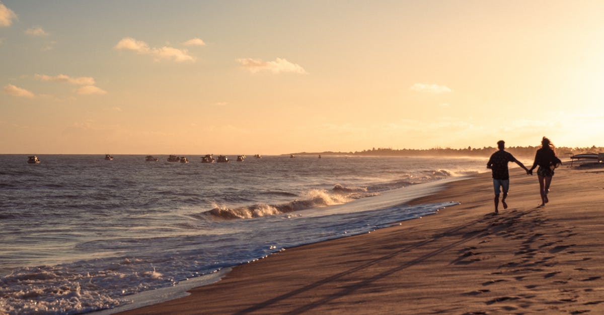 Rushing TH in C.O.C [duplicate] - Couple Standing on the Beach during Sunset