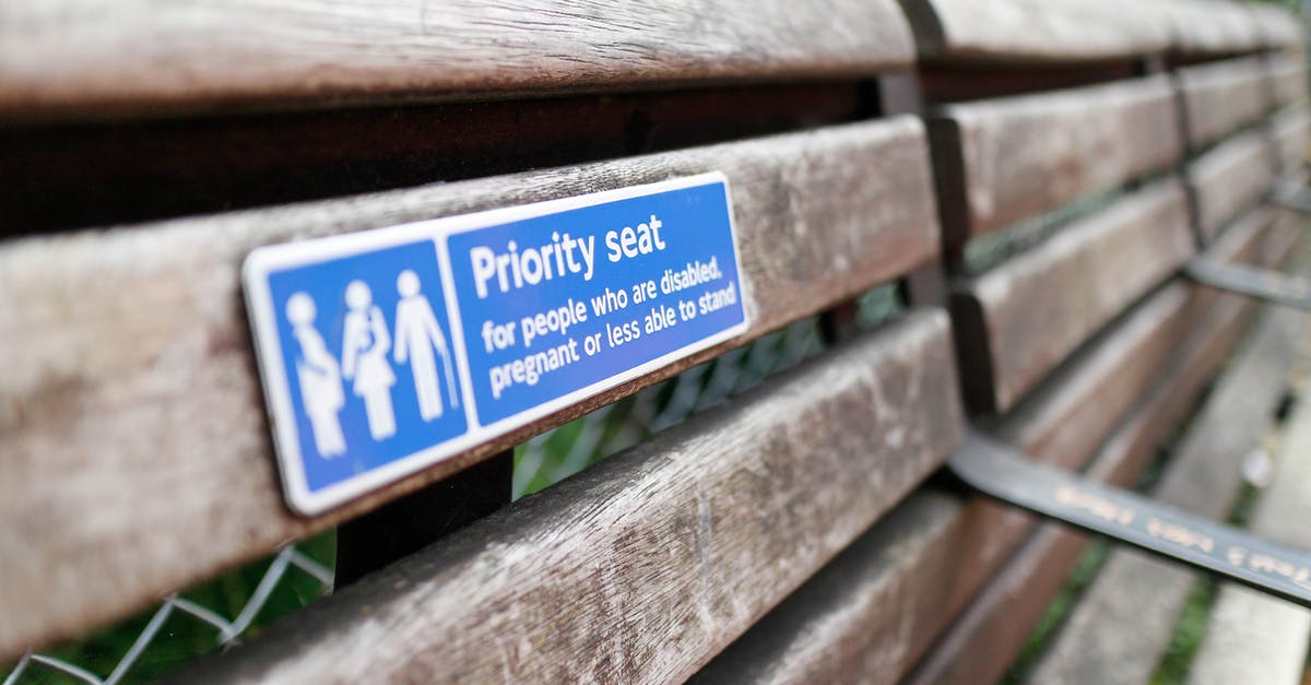 Sector priorities in FTL - A Wooden Bench with Priority Seat Signage