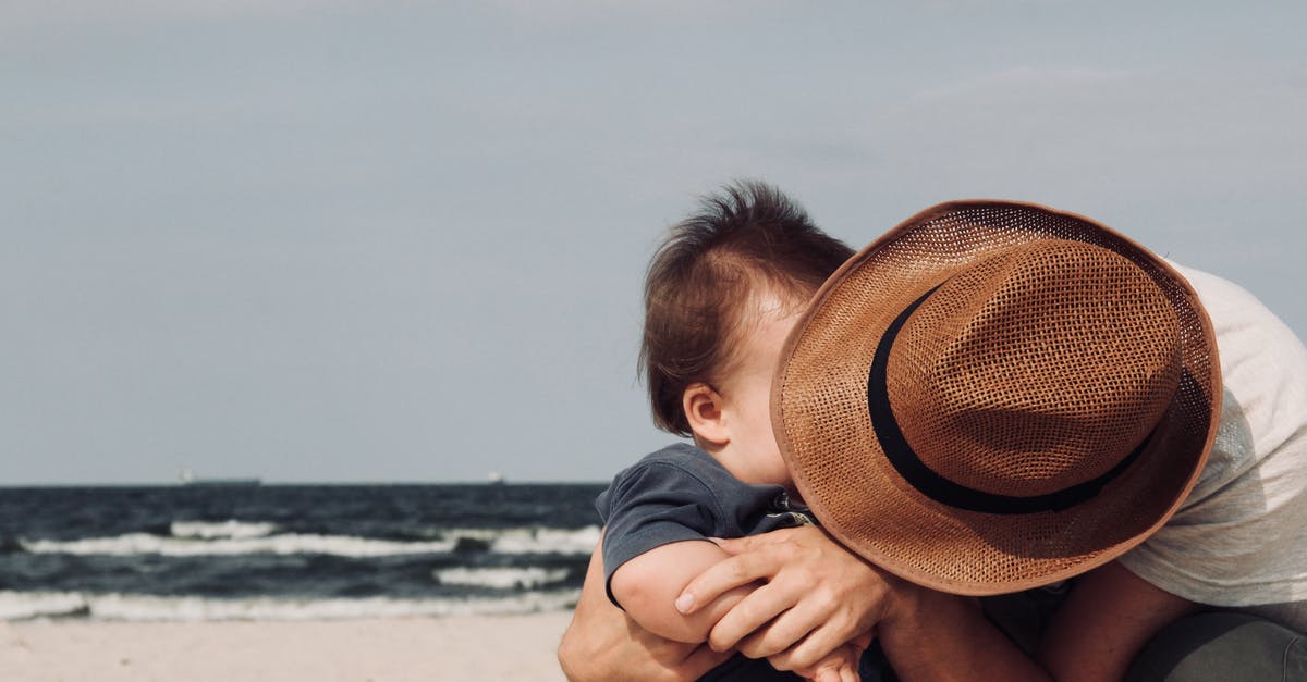 Send baby villagers through flowing water into soul sand elevator - Photo of Person Holding His Baby