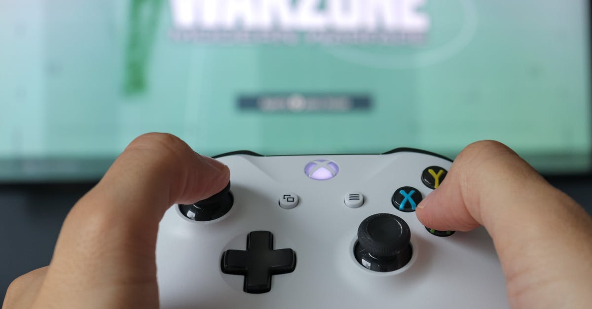 Share Xbox Game Pass between two consoles simultaneously - Close-Up Photo Of Game Controller