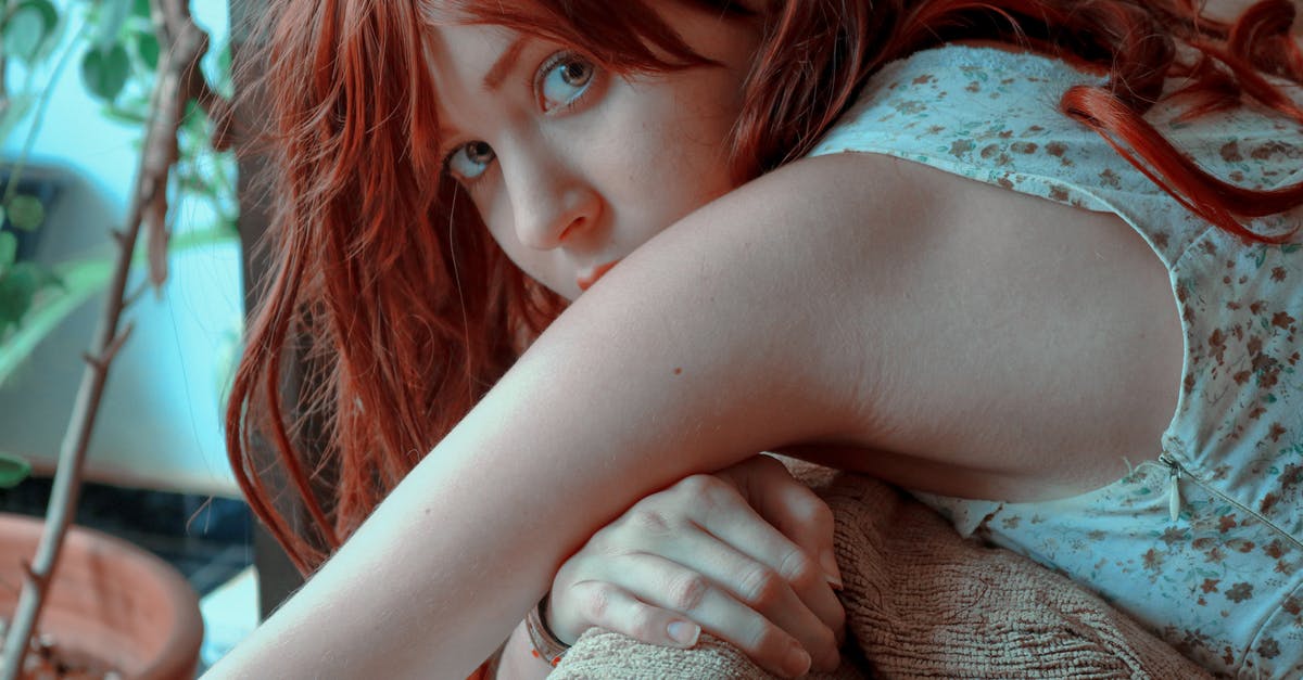 Shouldn't Greedier mode achievements also unlock Greed mode ones? - Close-Up Photo of a Woman with Red Hair Looking at the Camera